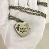 Collier coeur incrusté de diamants en bronze antique