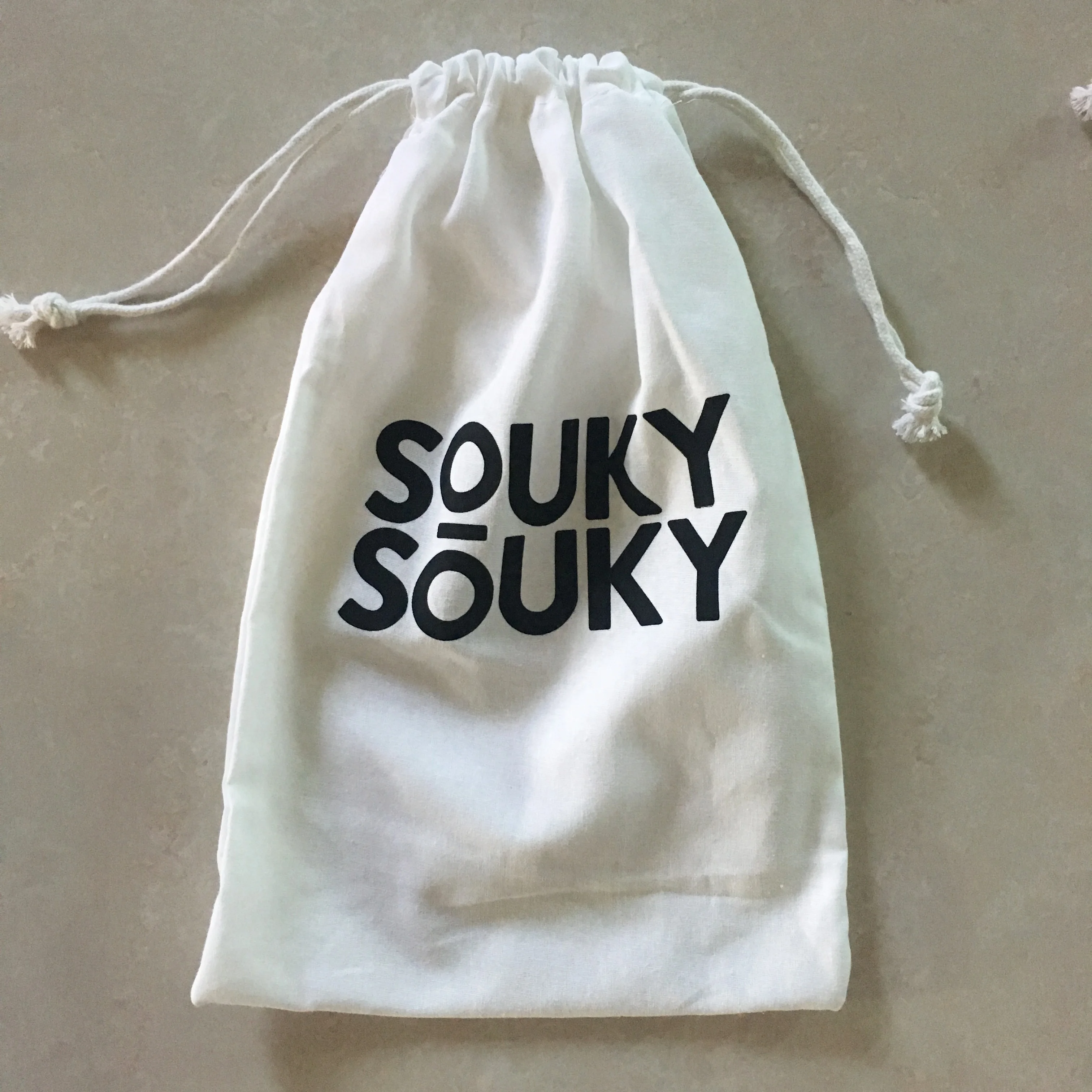 small white drawstring bags