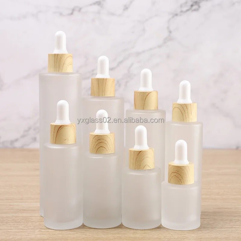 Frosted Essential Oil glass bottle serum glass bottle Flat Shoulder Dropper bottle with Plastic environmentally wood grain ring supplier