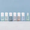 Perles de verre ordinaires + capuchon en plastique blanc