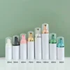 White bottle with electroplate pump head and clear cap