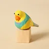 Bloque de madera de loro amarillo tallado en madera