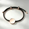 Cordoncino nero + ciondolo in oro rosa