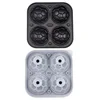 4 black football-shaped ice molds