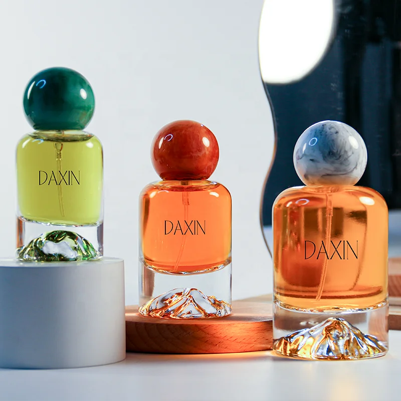 OEM/ODM 30ml 50ml 100ml Cylinder Glass Perfume Bottles with Gold Silver Blue Red Green Bottom for Gift Fragrance