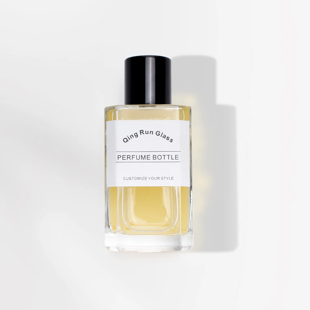 Clear Square Glass Perfume Bottles with Black Cylindrical Caps and Printed Labels