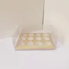 Caja de vasos de papel con 12 cápsulas redondas doradas