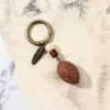 1698 Frutto a scaglie di drago con accessorio da appendere