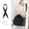 Black diamond-shaped crossbody strap