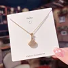 Abitino decorato in oro con strass pieni