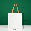 Bolso tote naranja de 21*23 con asa de lona blanca.