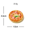 Pizza con prosciutto e funghi