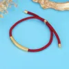Ciondolo in oro + cordoncino rosso scuro