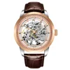 Two-tone case, gold face, leather belt, brown leather
