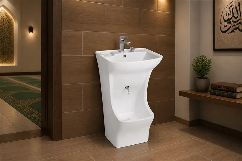 Angular white ceramic wudu basin in a quiet office prayer room washroom