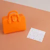 Orange bag + sheet music