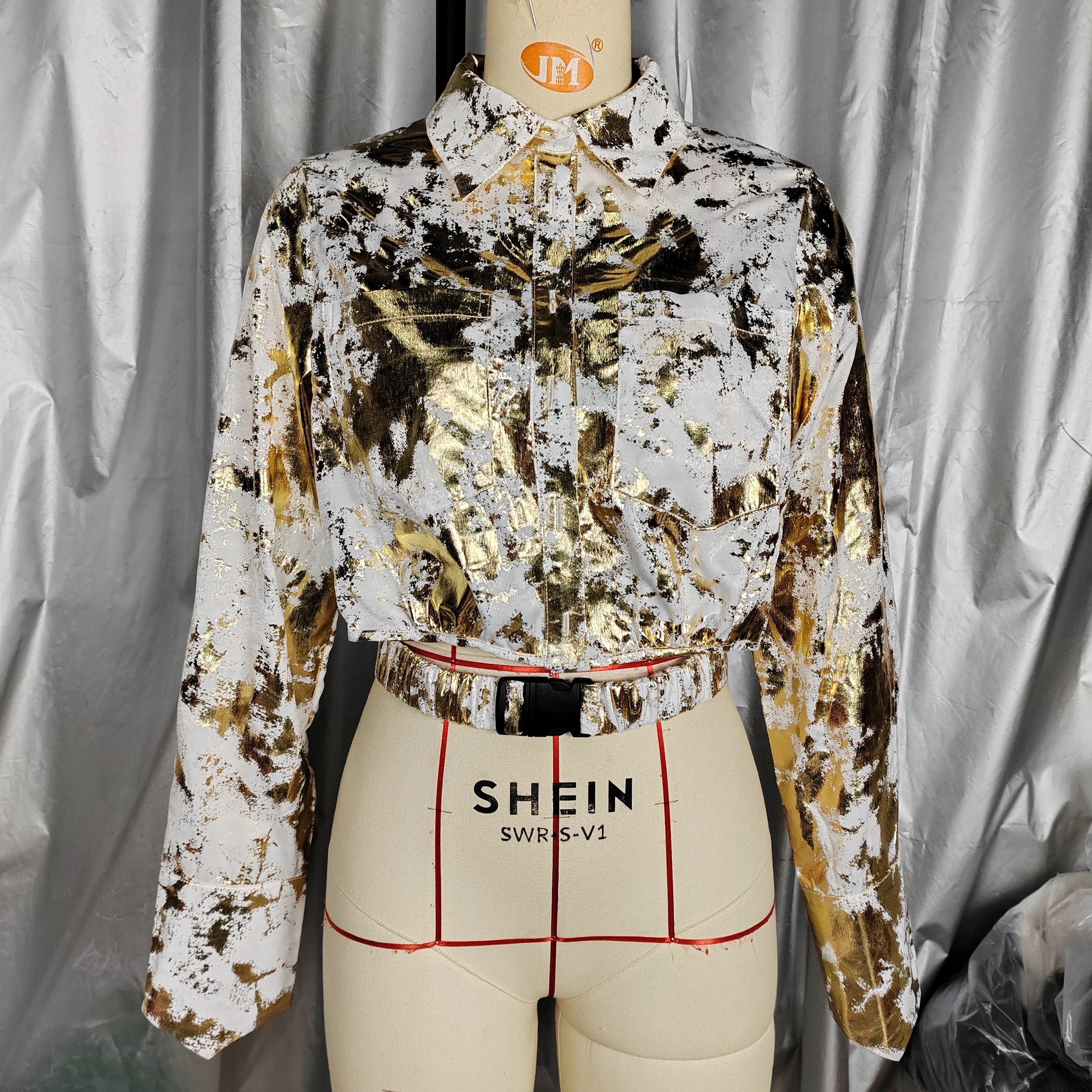 A Fashionable Shirt For Women With Gold Curly Patterns. - Image 1