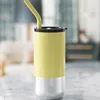Plástico amarillo por dentro y acero por fuera.