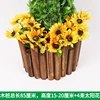 Four bunches of sunflowers on the wooden stake