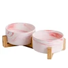 Pink ceramics double bowl with wooden frame