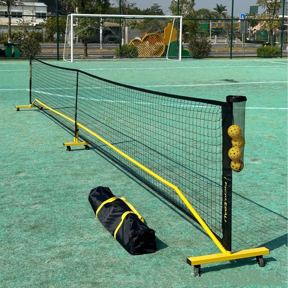 22ft Outdoor Portable Pickleball Net for Driveway Durable PE Knitted Net with Court Lines and 6 Wheels for Pickleballs factory