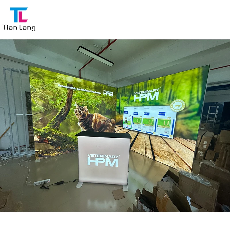 Reka Bentuk Baru Bingkai Aluminium SEG Cetak Terbitan Kustom Kain Rentang Pencahayaan Belakang Portable LED Modular 10x20 Booth Pameran Paparan