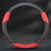 Ante y piel de vacuno; negro con detalles rojos; sin logo.