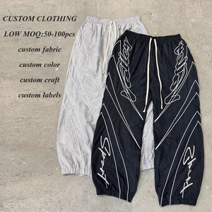 Hot Selling Streetwear Jogger Track Pants Custom Embroidery Logo Men Solid Color Windbreaker Pants Blank Nylon Track Pants