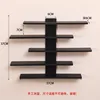 Estante de almacenamiento negro de cinco niveles para montaje en pared