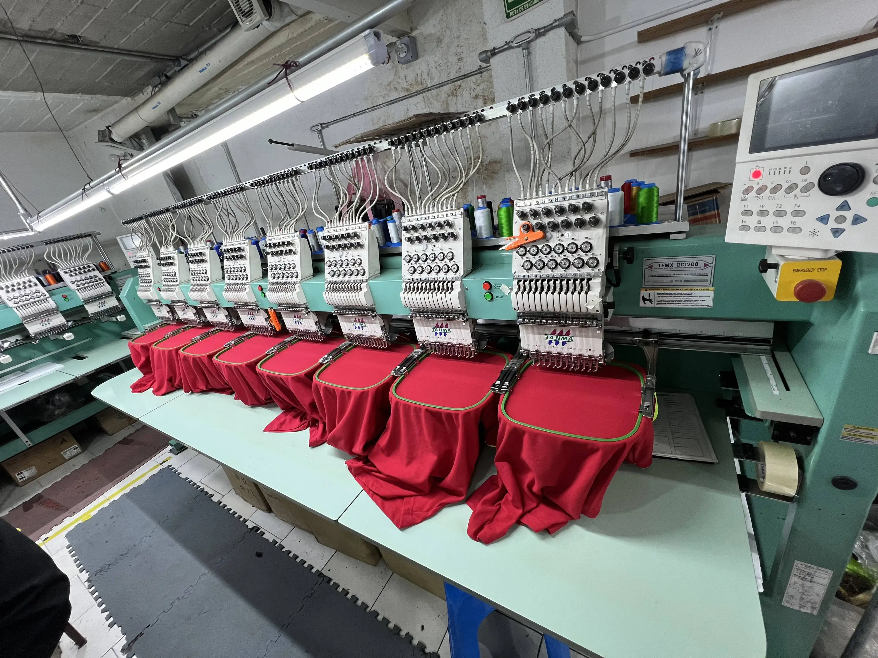 Tajima Embroidery Machines with a Backdrop of Isacord Thread