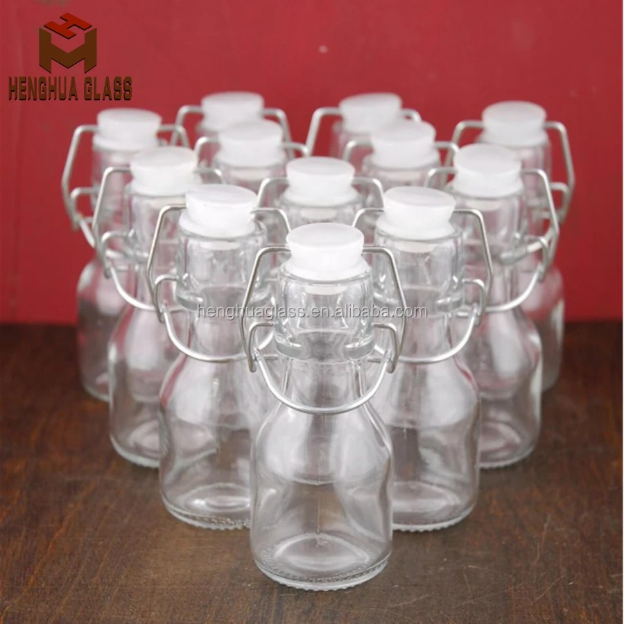 Small Mini 50ml 2oz Round Shape clear Drinks Swing Top Olive Oil Liquid Glass Container Bottle Wholesale