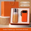 Orange titanium-coated insulated cup, power bank