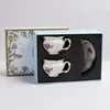 white-double cup and saucer