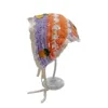 Petite fleur printanière orange-violet