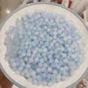 สีฟ้า สีขาว และสีม่วง [ลูกปัดเปลี่ยนสีไวต่อแสงขนาด 8 มม.]
