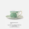 Light-by-light coffee cup and saucer