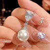 Pendentif perle blanche avec chaîne