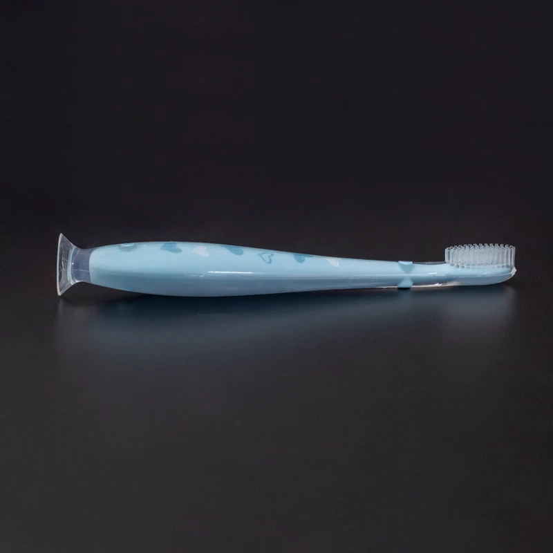 OEM цветной защитный блок, предотвращающий проглатывание, синяя ручка, стоячая всасывающая детская силиконовая зубная щетка