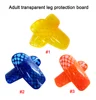 Tabla protectora de piernas transparente para adultos.
