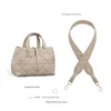 Grayish-brown diamond-shaped crossbody strap