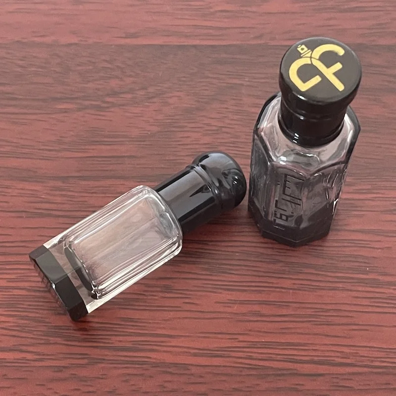 Boming Wholesale 3ml 6ml 12m Fancy Arab Attar Bottle Black Roller Bottle Glass Stick Bottle with Crystal Base
