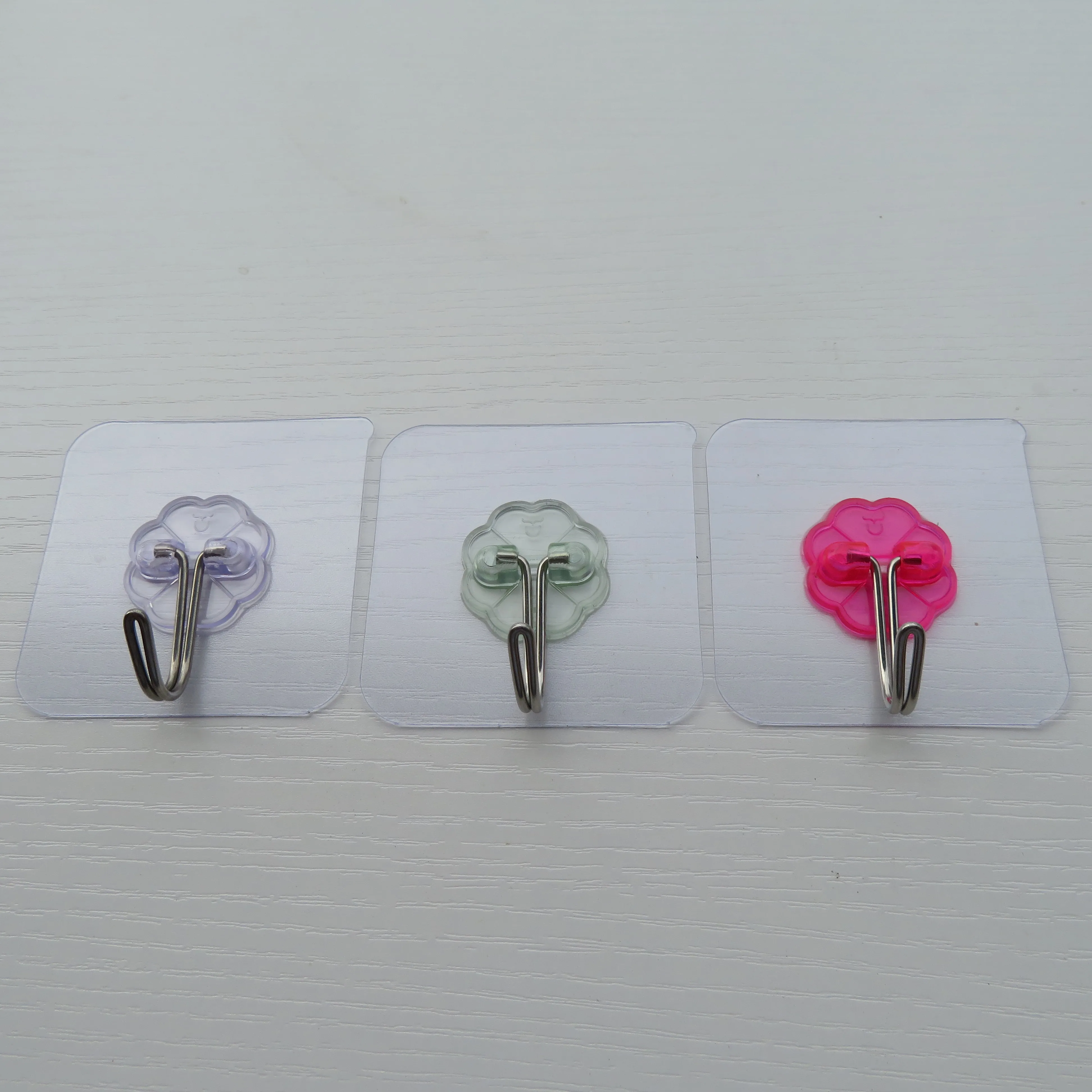 Can process and customize a variety of color plum pieces of metal traceless novelty hooks factory direct sales details