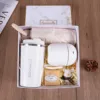Taza blanca, humidificador, jabón, llavero, paraguas, caja de regalo.