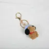 Brown snoopy with blue hat-gold buckle