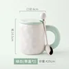 Green and white spoon with lid
