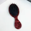 Dientes de peine con cerdas de cerdo rojo texturizadas