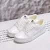 Dunk in pure white-nude shoes pair