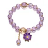 Bracciale con perline a forma di margherita color viola scuro
