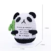 Black Panda hugging bamboo