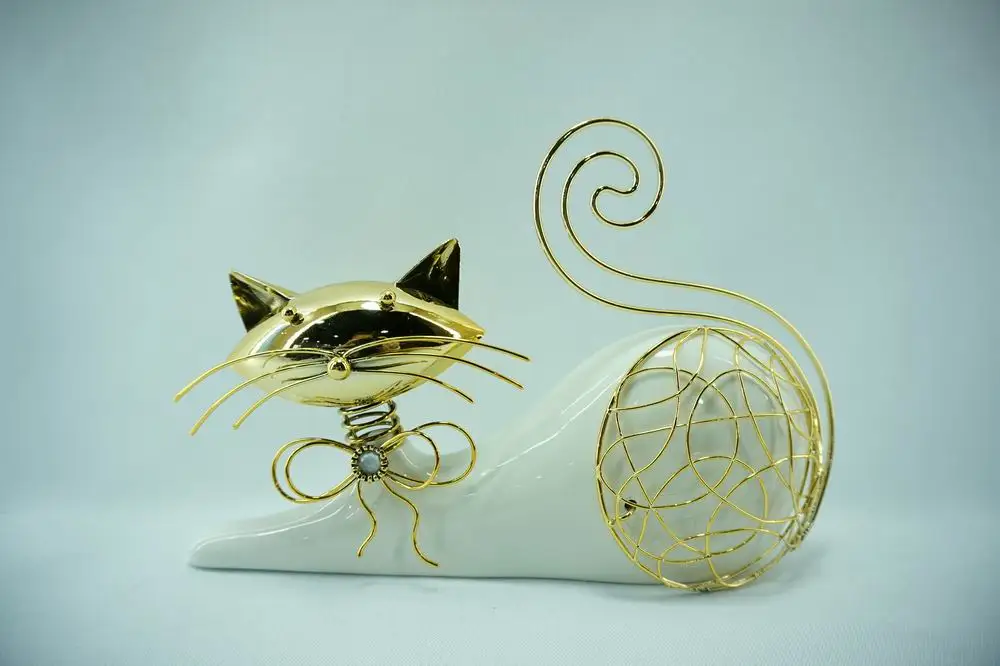 Ceramic and metal bird, owl, cat, elephan